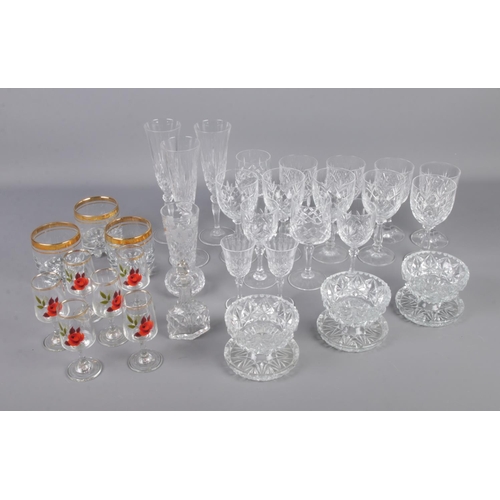 132 - A large collection of cut and pressed glass including desert dishes, wine glasses, champagne flutes,... 