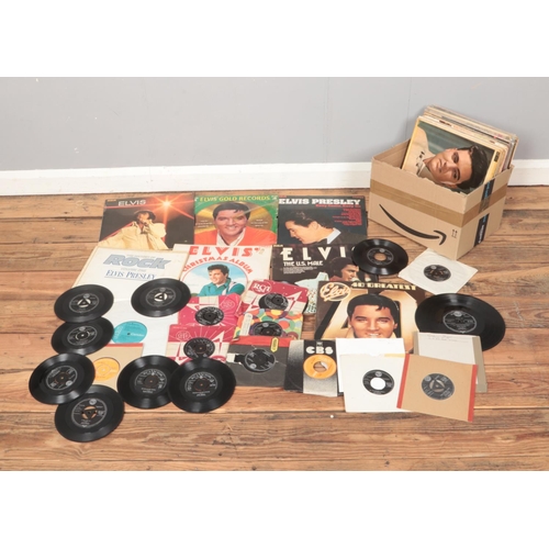 139 - A collection of Elvis Presley records and single including You'll Never Walk Alone, The Christmas Al... 