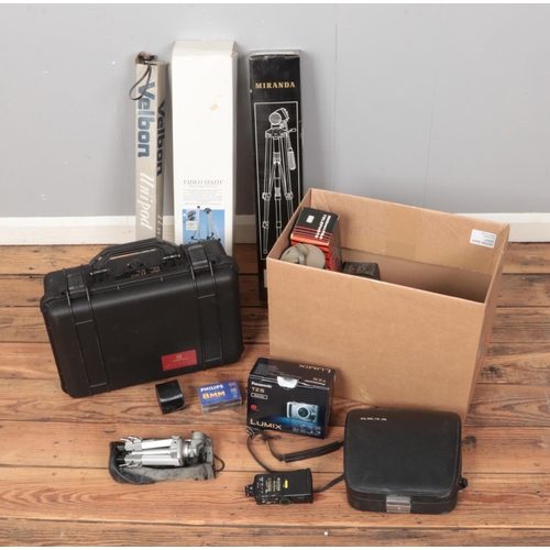 158 - A box of photographic equipment including Elmo Super 106, boxed tripods, lens, hardcase, etc.