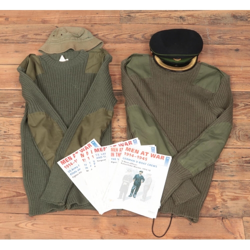 159 - Two army jumper pull overs with RADC cap, army bucket hat and several editions of men at war magazin... 