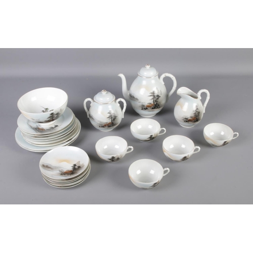 163 - Oriental style china tea set with tea pot, milk jug, serving plates and more.