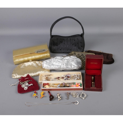 171 - A collection of costume jewellery and vintage purses to include several brooches, ladies Seiko wrist... 