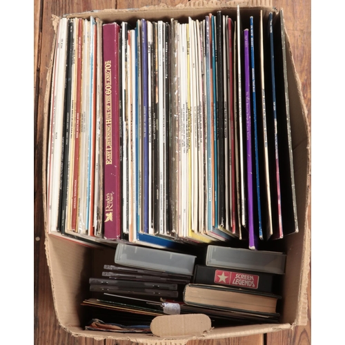 180 - A box of assorted vinyl records and singles of mainly pop and easy listening to include Madonna, Abb... 