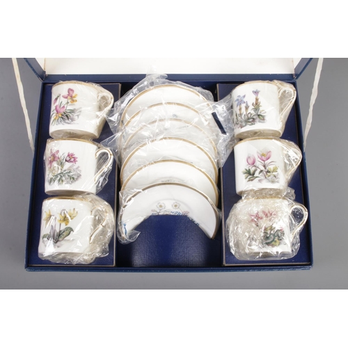 33 - A cased Royal Worcester 'Alpine Flowers' coffee set, containing six cups and saucers.