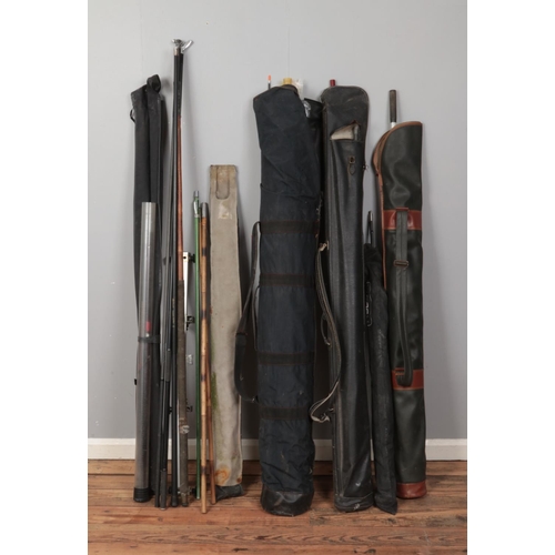 190 - A large collection of assorted fishing equipment including selection of rods, nets, carry bags, etc.