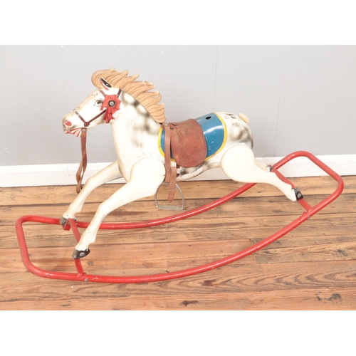 206 - A vintage painted metal child's rocking horse.