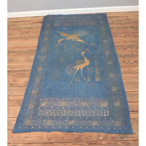 225 - A vintage painted linen cloth featuring oriental inspired crane design with floral border. Approx. d... 