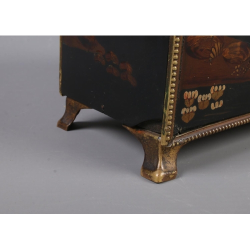 68 - A lacquered mantel clock with chinoiserie decoration and gilt metal mounts.