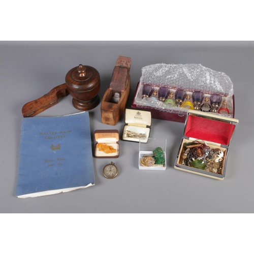 75 - A quantity of collectables including costume jewellery, boxed miniature glasses, wood plane, etc.