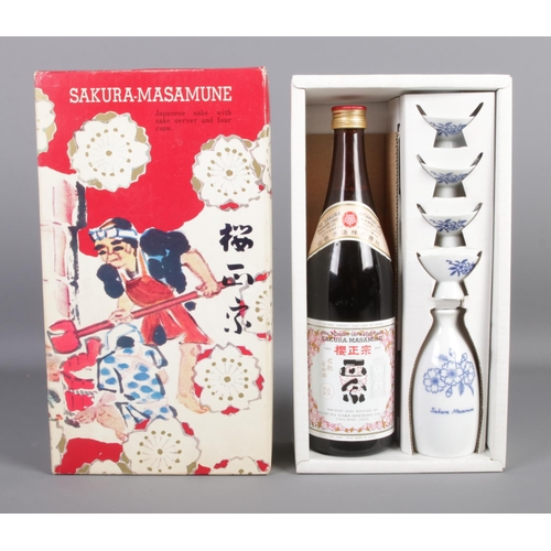 76 - Sakura-Masamune; a cased set, to include sealed 720ml bottle, sake server and four cups.