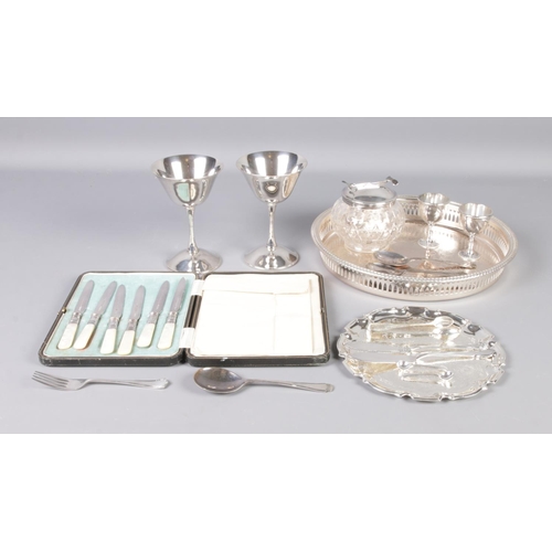 79 - A collection of silver plate to include James Dixon and Sons cased fruit knives, goblets, decorative... 