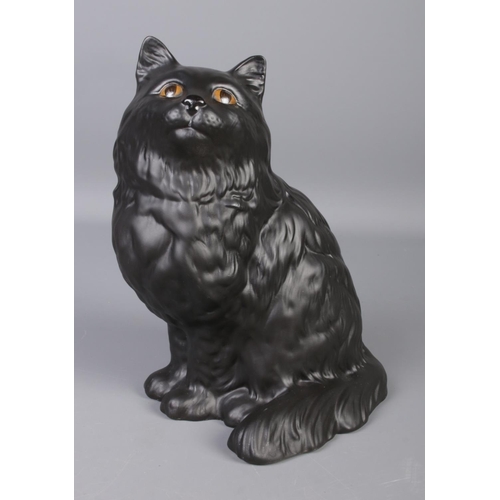 85 - A Beswick Persian Cat in matte black. Approx. height 21cm.