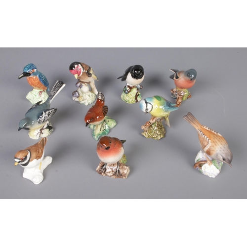 86 - Eight Beswick bird figures along with Royal Worcester and Goebel examples. Includes Kingfisher, Grey... 