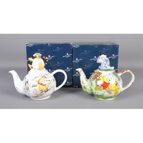 93 - Two boxed Border Fine Arts Disney Winnie The Pooh Character teapots including summer and winter desi... 