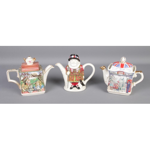 96 - Three James Sadler novelty teapots including Alice in Wonderland, Piccadilly and Yeoman Warder.