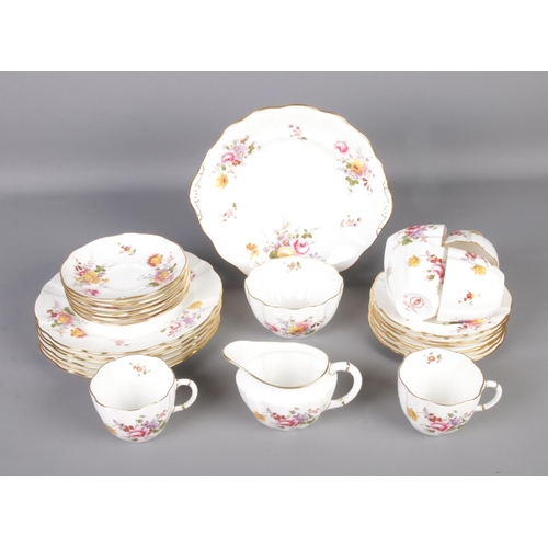 97 - A Royal Crown Derby tea service in the Derby Posies pattern. Includes milk jug, sugar bowl, teacups,... 