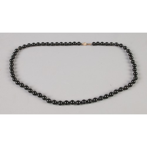 289 - A French jet graduated bead necklace with 14ct gold clasp.

Unclasped length 62cm