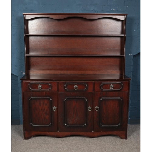 447 - A dark oak dresser.

Hx164cm
Wx137cm
Dx41cm