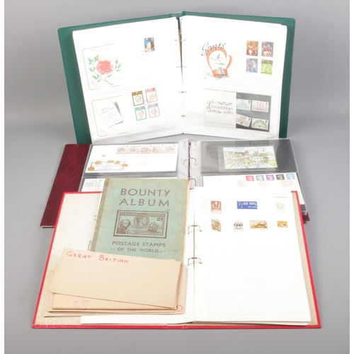 41 - Three albums of stamps including first day covers, presentation packs and loose examples.