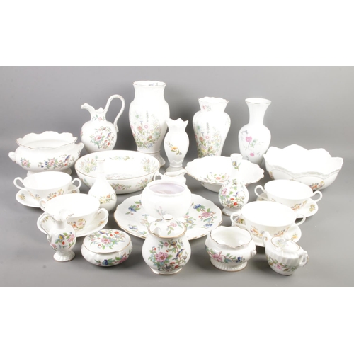 158 - A large quantity of Aynsley ceramics. Includes Pembroke, Wild Tudor, Cottage Garden, etc.