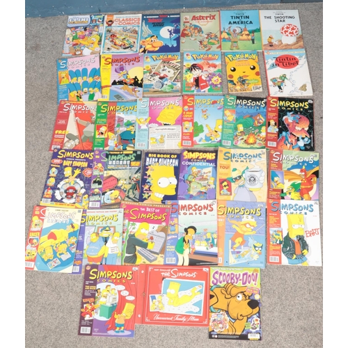 493 - A quantity of comics. Includes Pokémon, Simpsons, Tin Tin, etc.