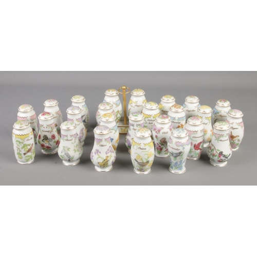 113 - A large quantity of Lenox porcelain storage jars, Birds and Blossoms.