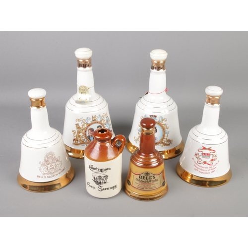 114 - Five Bell's whiskey decanters and a small flagon.