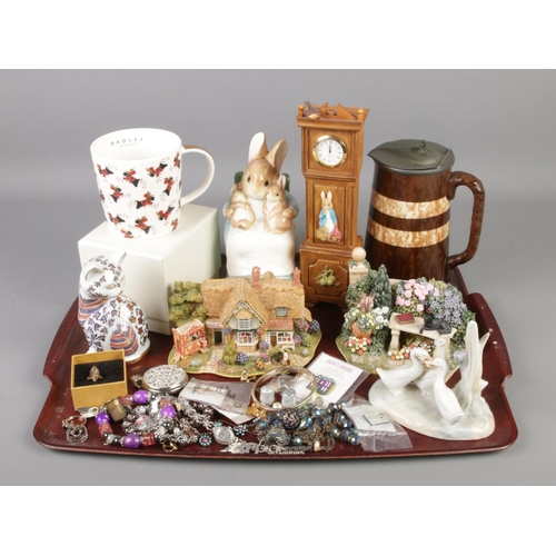 118 - A tray of ceramics and costume jewellery. Includes Border Fine Arts Peter Rabbit Clock, Lilliput Lan... 