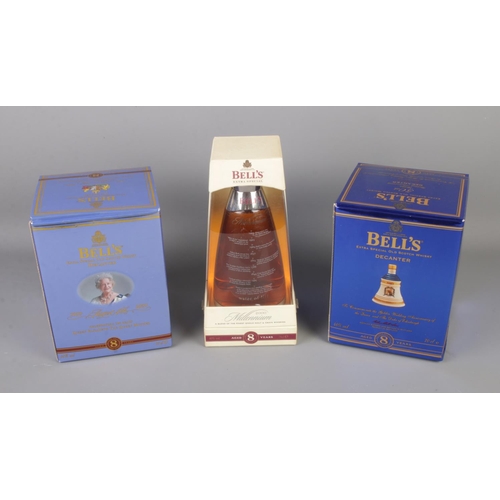 121 - Two boxed Bell's extra special old scotch whisky decanters along a Millennium 2000 Bell's extra spec... 