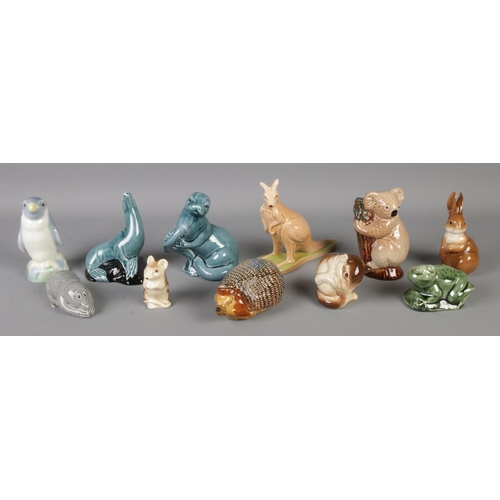 129 - A collection of ceramic animals, to include Wade Kangaroo and Koala Bear, Poole seal and mice.