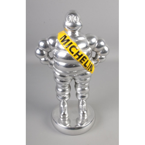 134 - A Michelin Man chrome plated advertising figure. 
Height 35cm