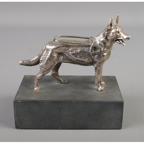 135 - A cast metal figure of a guide dog on slate base by Louis Lejeune.