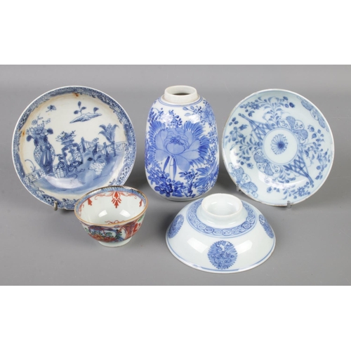 155 - A collection of Chinese porcelain. Includes blue and white saucers, vase etc.