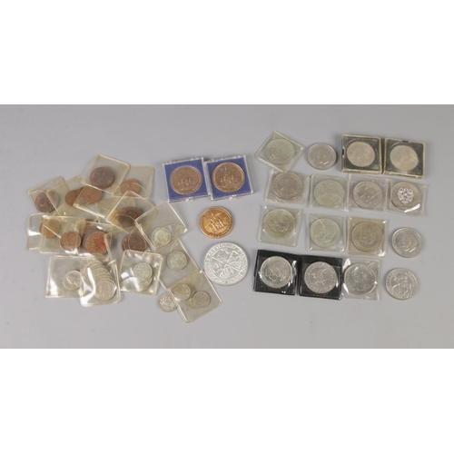 19 - A collection of coins including several one shilling coins of various dates, half shillings, sixpenc... 