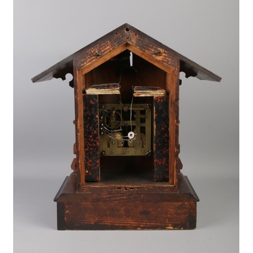 21 - A Black Forest cuckoo clock, with roman numeral dial, chiming on a coiled gong. Movement stamped for... 