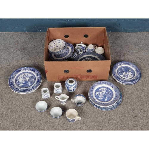 167 - A box of mixed blue and white ceramics including pieces by W.R.Midwinter Ltd.