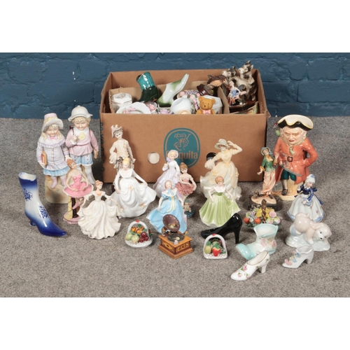 169 - A large quantity of ceramic and resin figurines including ballerinas, maidens, animals and more.