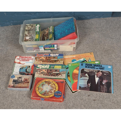 172 - A box of miscellaneous to include several Giles jigsaw puzzles, assorted vinyl including Elvis, chil... 