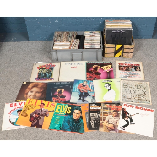 201 - Two boxes of LP and single records. Includes Status Quo, Cliff Richard, Beach Boys, Elvis, etc.