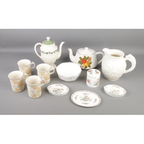 215 - A quantity of mixed Wedgwood ceramics including teapots, coffee mugs, pitchers and more