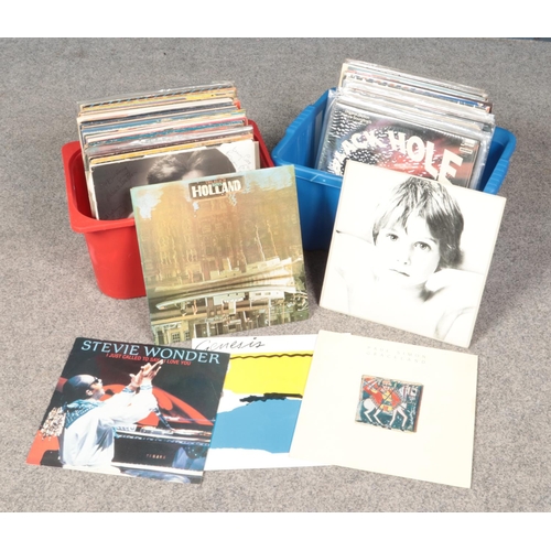 219 - Two boxes of LP records. Includes U2, Elton John, Paul Simon, Beach Boys, Status Quo, ABBA, Elvis, e... 