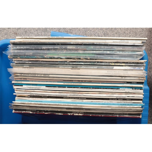 219 - Two boxes of LP records. Includes U2, Elton John, Paul Simon, Beach Boys, Status Quo, ABBA, Elvis, e... 