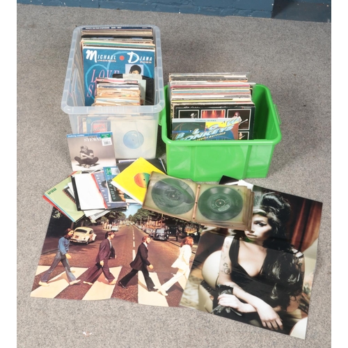 221 - Two boxes of LP and single records. Includes Wham, Elvis, The Shadows, etc. Beatles and Amy Winehous... 