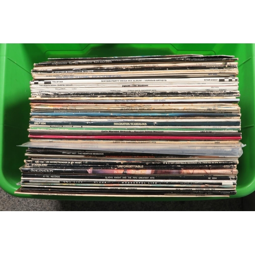 221 - Two boxes of LP and single records. Includes Wham, Elvis, The Shadows, etc. Beatles and Amy Winehous... 