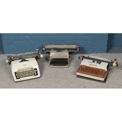 268 - Three typewriters; Olivetti Lexikon 80, Smith-Corona Coronamatic 8000 and Olympia examples.