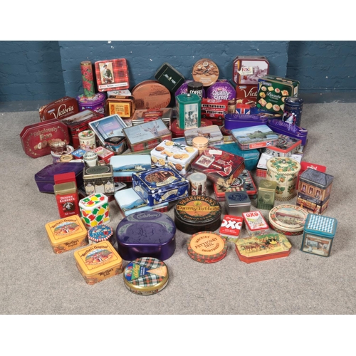 276 - An extensive collection of advertising tins including Oxo, Harrods, Cadbury's and other examples.