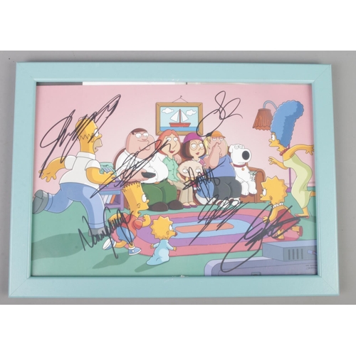 44 - Two framed pictures, Disney Frozen and The Simpsons & Family Guy with signatures.