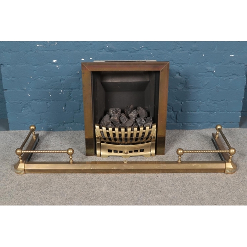 278 - A 'Fuel Effect Fires Ltd' gas fire, with surround, grate and extending fender.