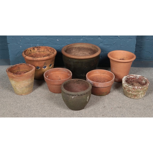 281 - A quantity of garden planters. Includes terracotta examples, etc.