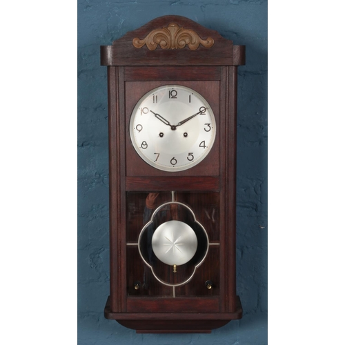 294 - A 1920s mahogany Art Deco Haller wall clock.